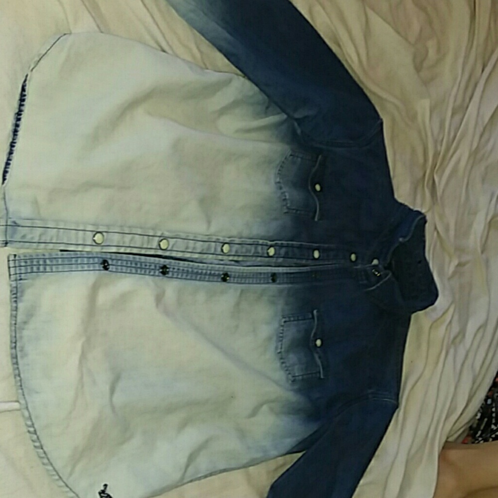 A blue and white denim button up jacket.